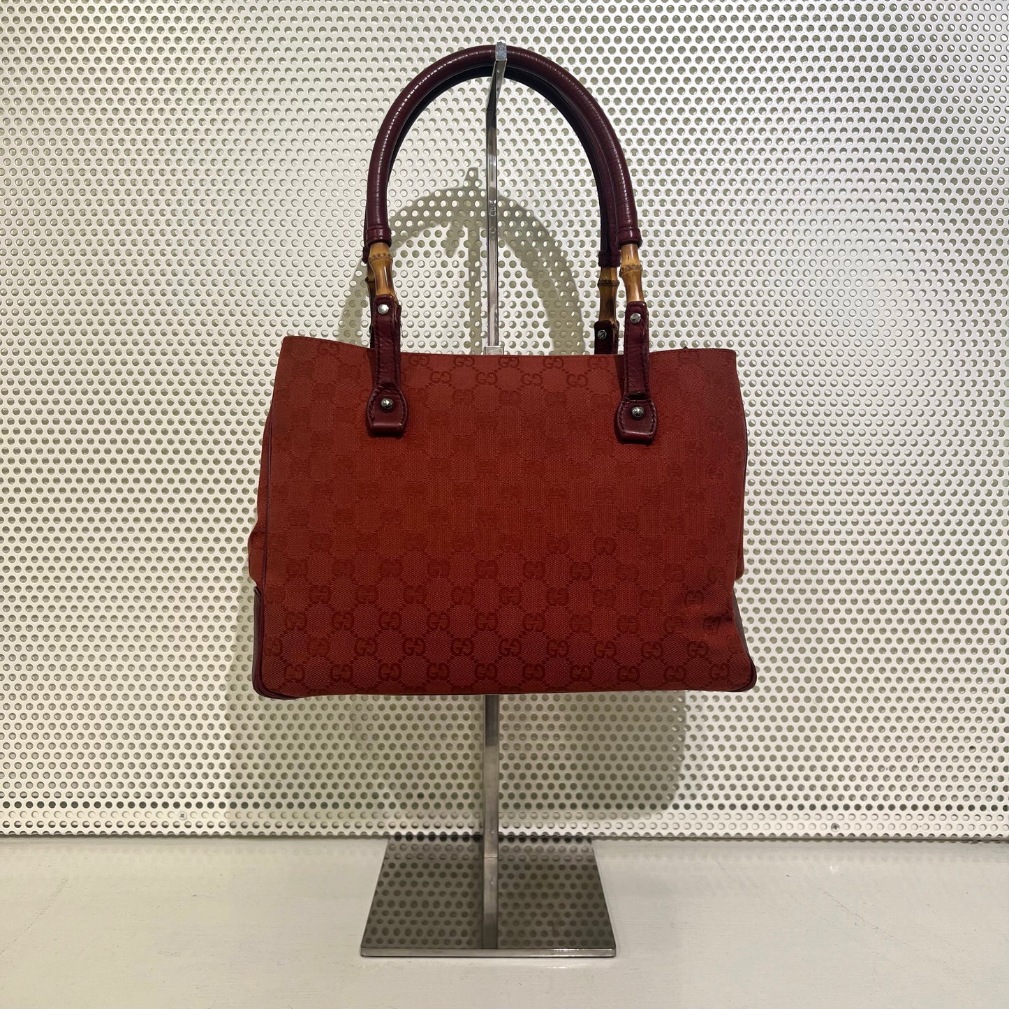 Gucci red monogram bag with bamboo details