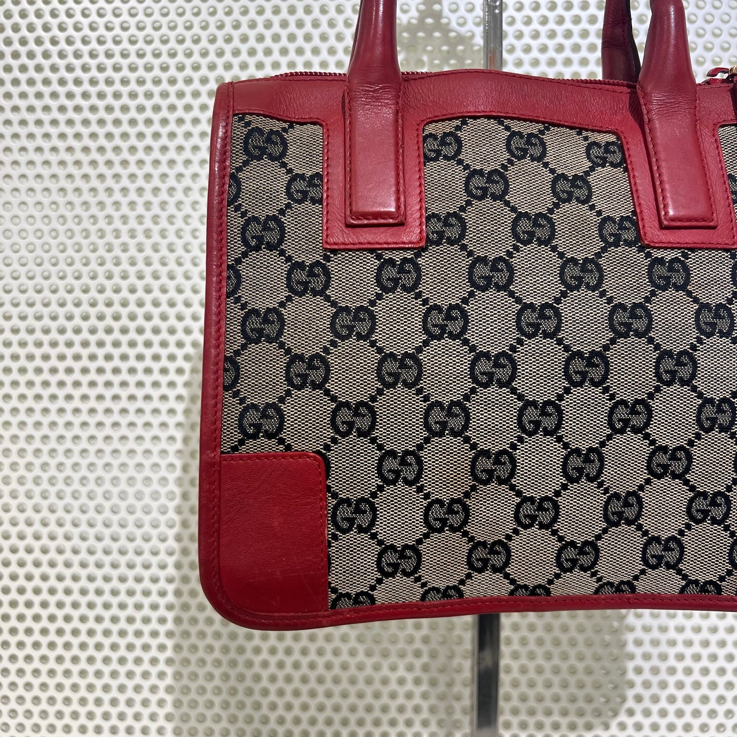 Gucci red monogram bag with red leather trimmings