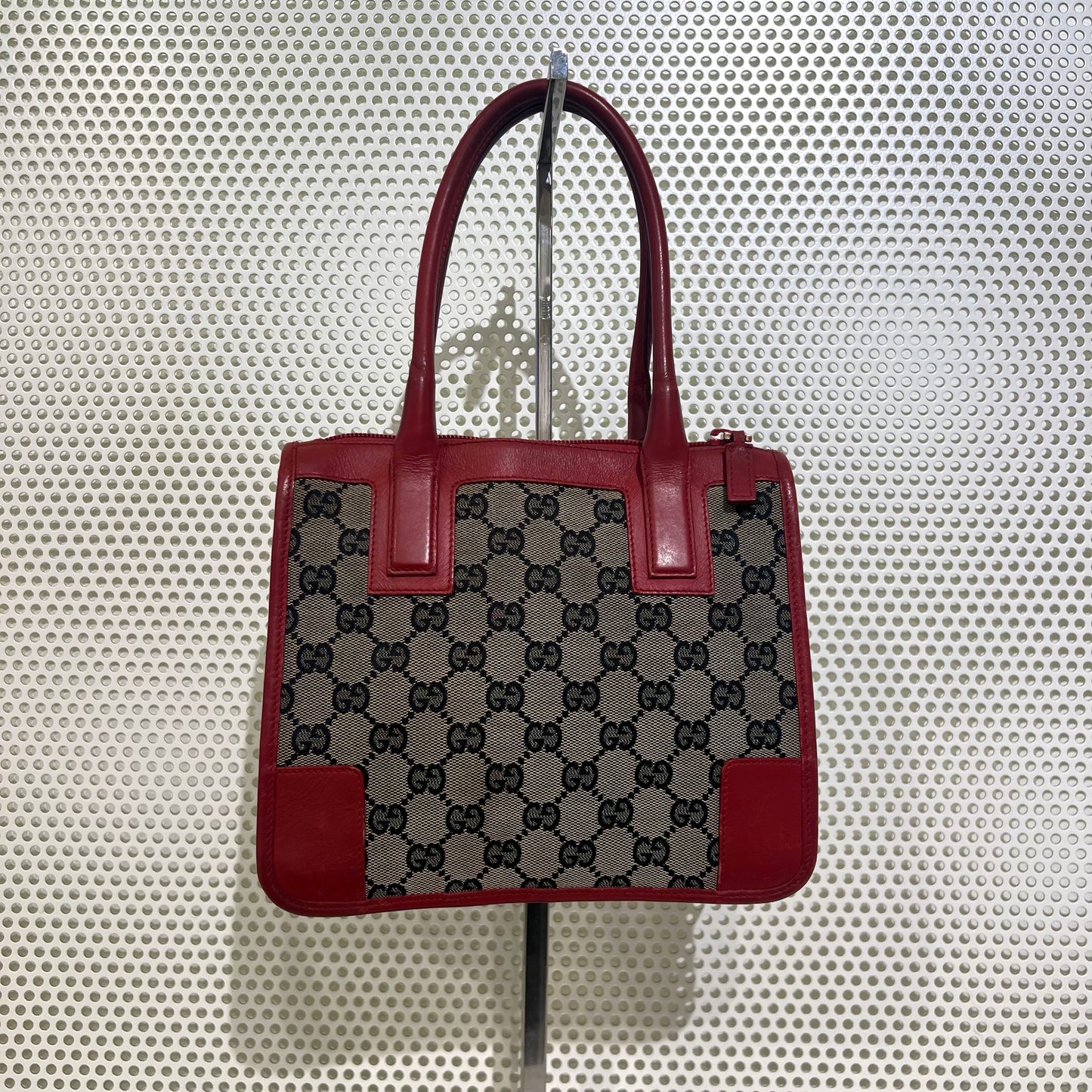 Gucci red monogram bag with red leather trimmings