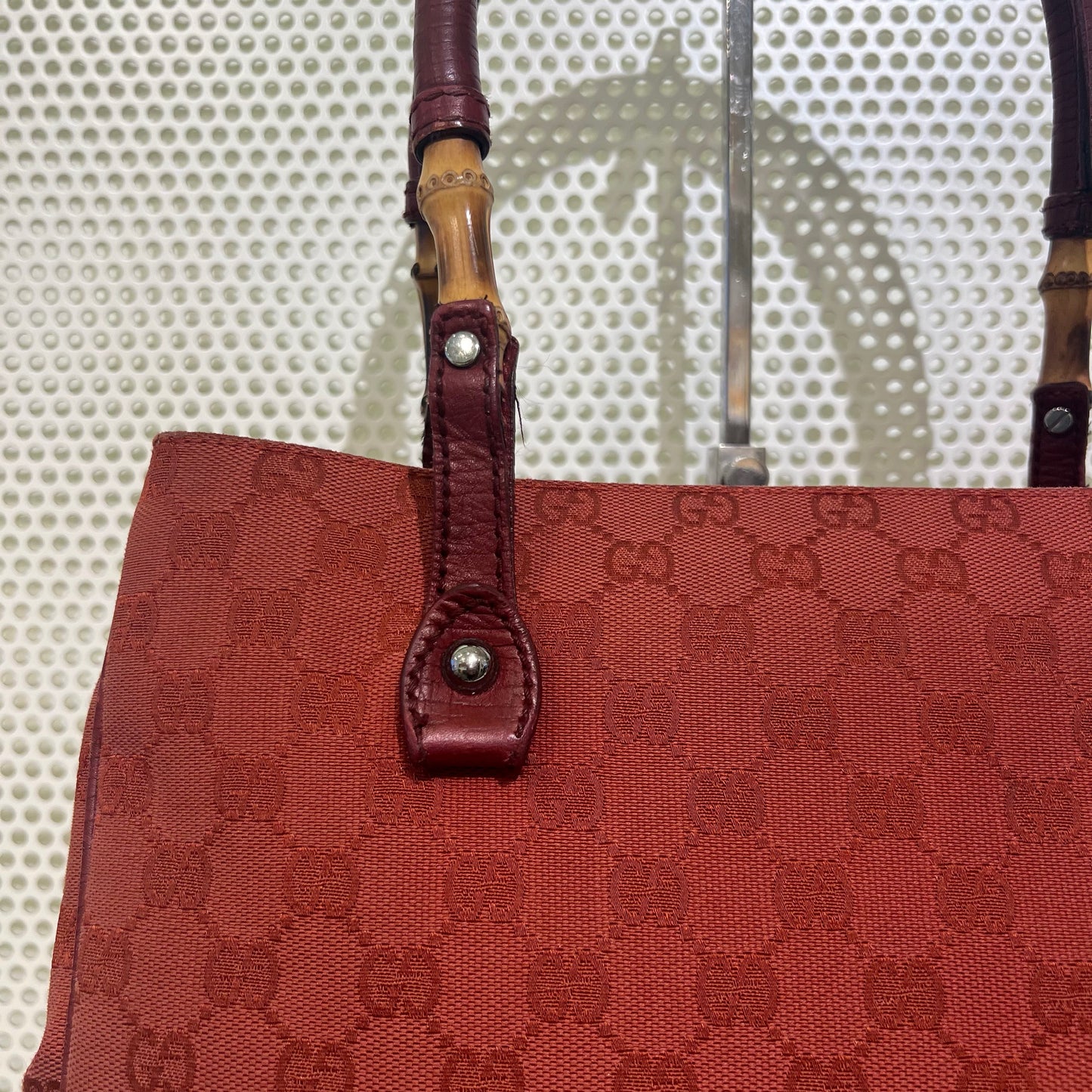 Gucci red monogram bag with bamboo details