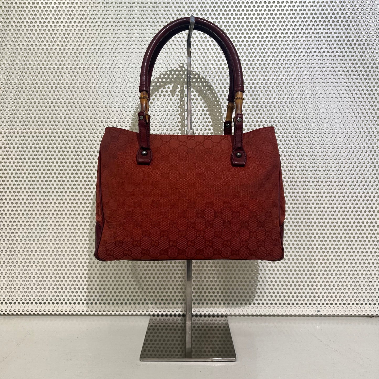 Gucci red monogram bag with bamboo details